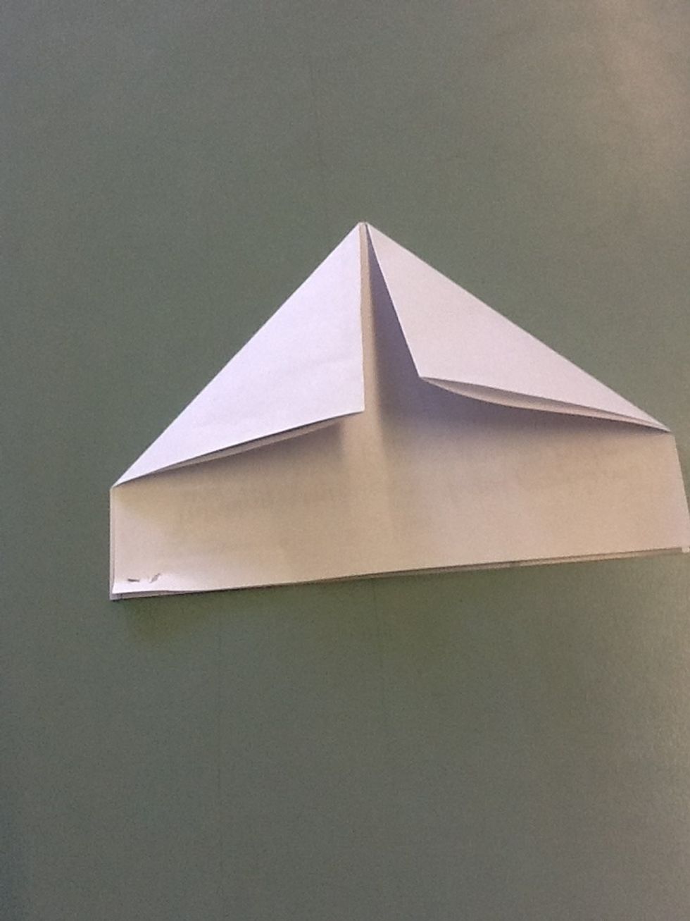 Fold in both corners on the folded side (make sure it's not the open side!)