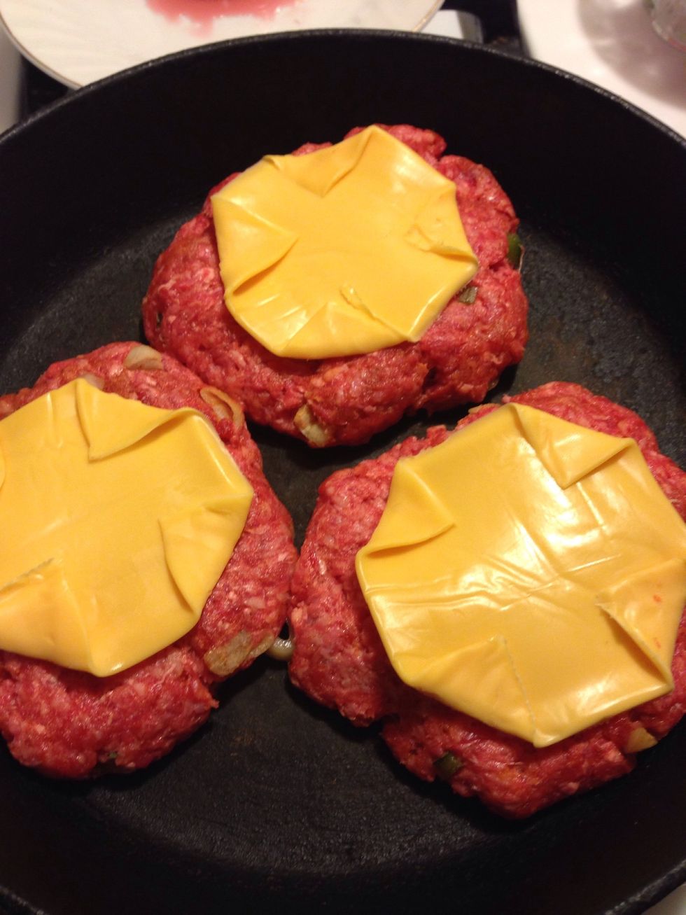 Fold-in corners of slice(s) of American cheese and lay atop each pattie. *If you or your guy does not prefer cheese, omit this step