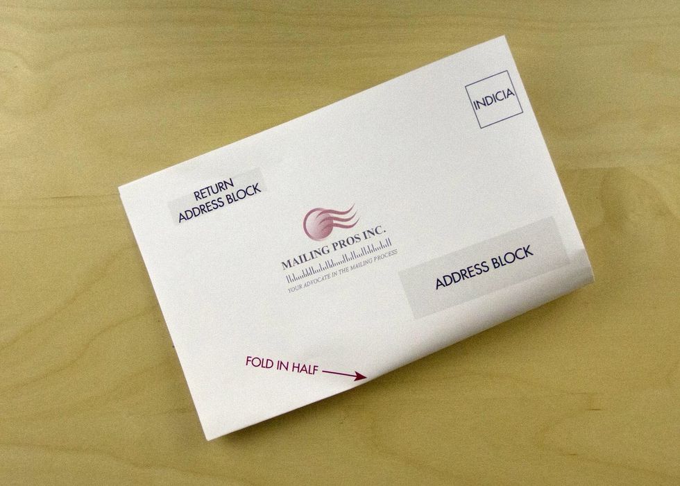 Fold in half again perpendicular to the longest edge. Keep this fold on the bottom.