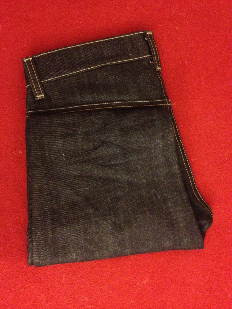 Fold in half again up to the double stitching on the back.