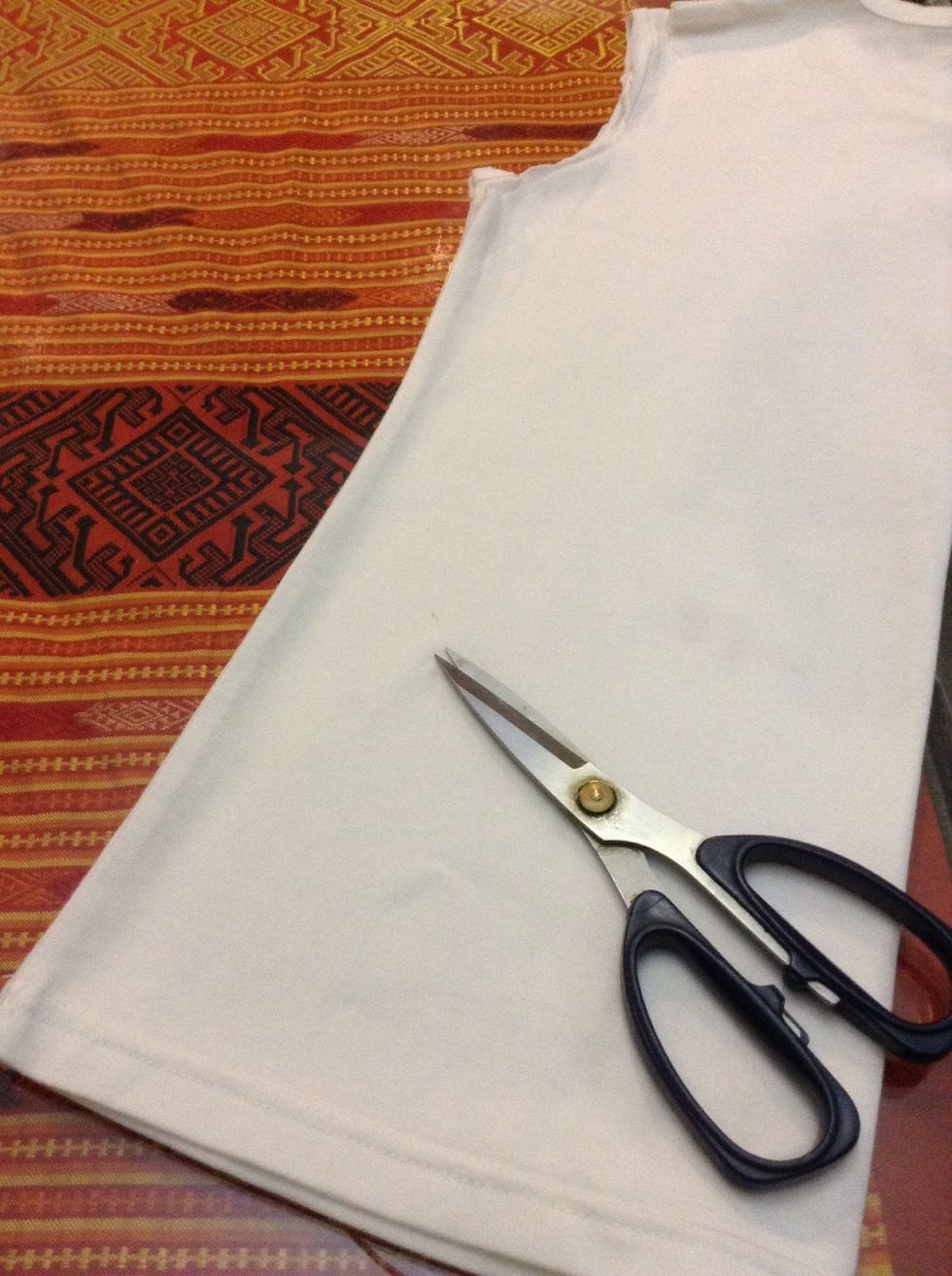 Fold In half, and cut 1 inch wide stripes until the end on the sleeve.( from left to right, not top to bottom) 1 used 15 stripes for my scarf.