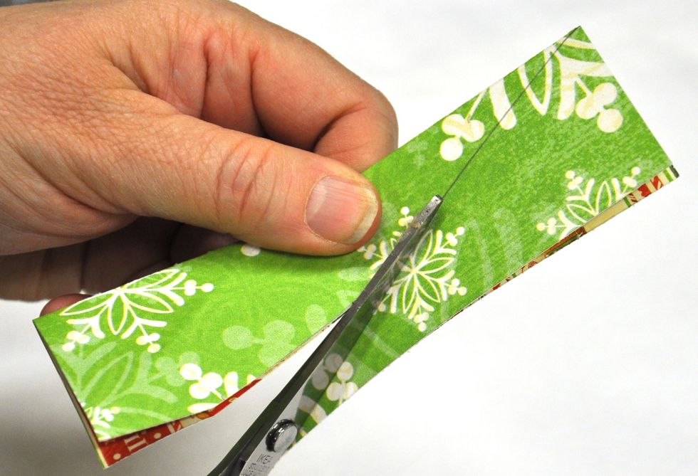 Fold in half and trim along the pencil line.