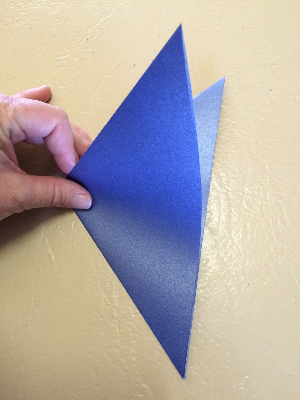 Fold in half diagonally again