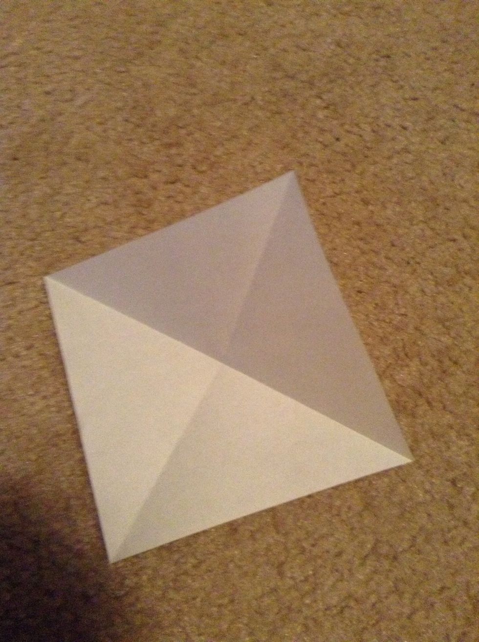 Fold in half diagonally both ways