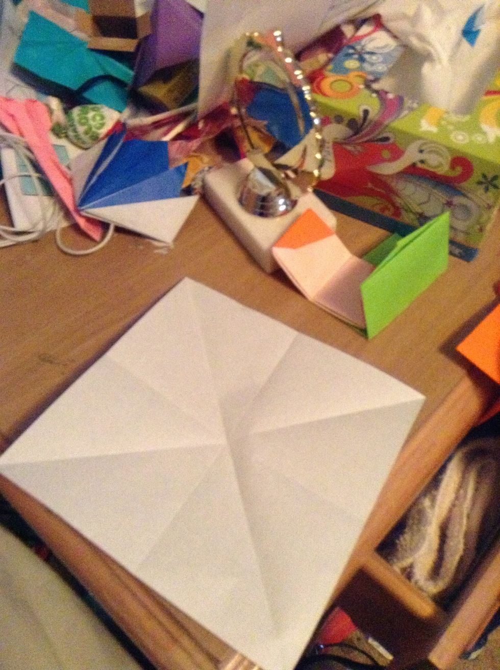 Fold in half diagonally the other way