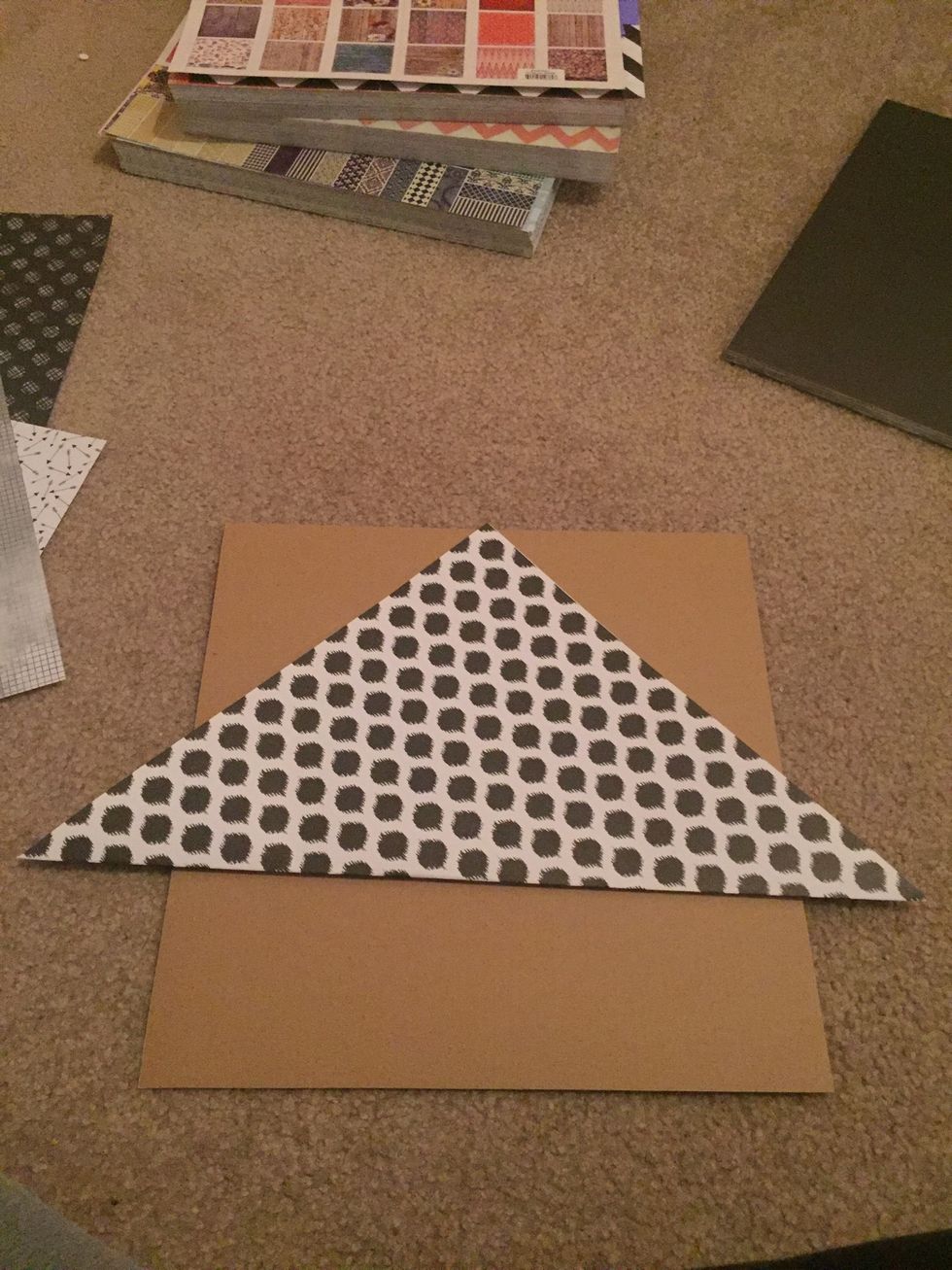 Fold in half diagonally.