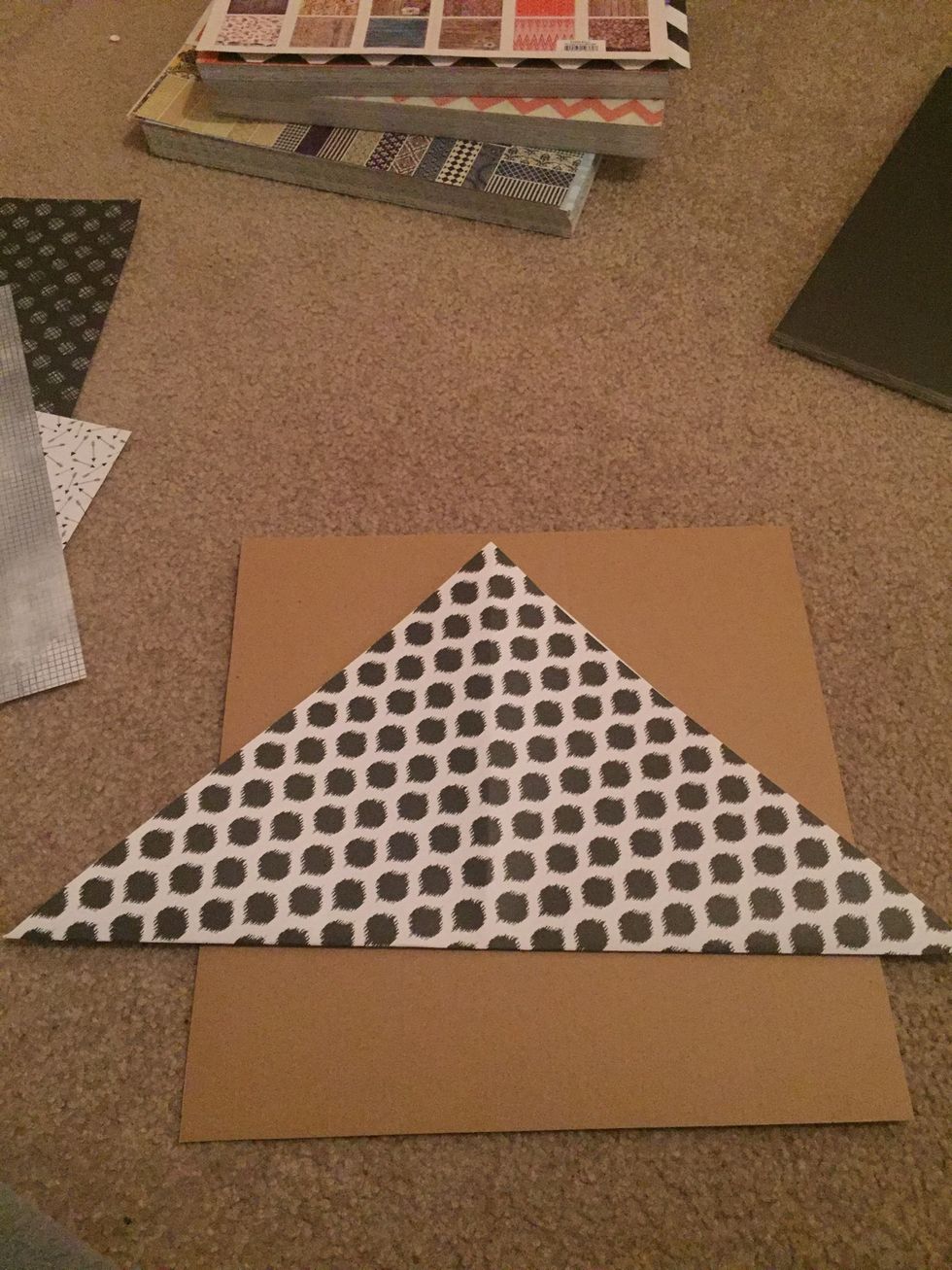 Fold in half diagonally.