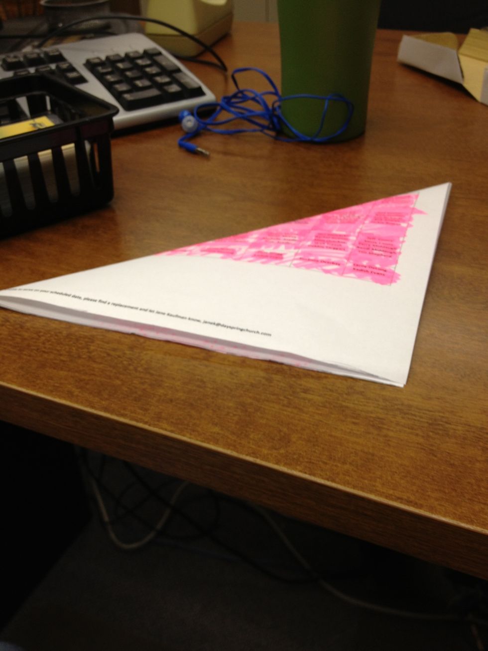 Fold in half diagonally.