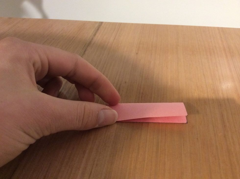 Fold in half longways and unfold.