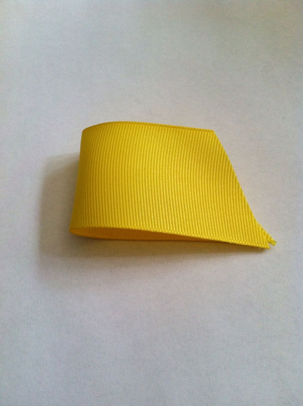 Fold in half. Make sure if your ribbon has a 'face' side, that you fold it so that side is showing.
