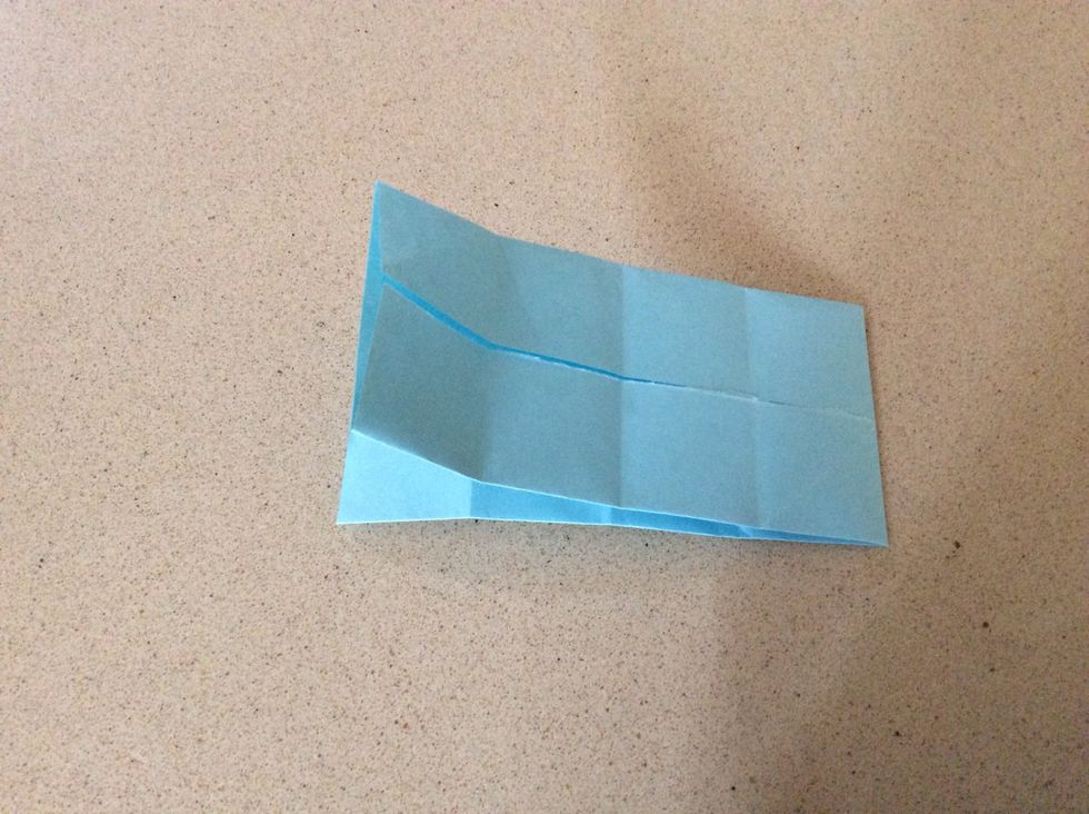 Fold in half so your model looks like this. If you fold it the wrong way, the next few steps will end up on the outside of your model