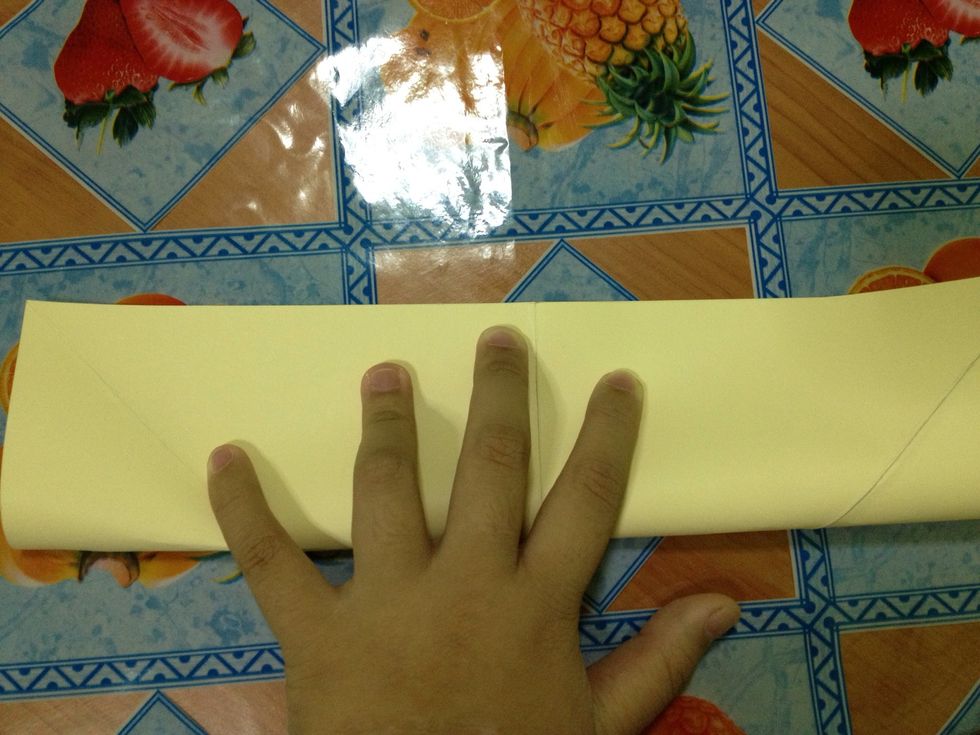 Fold in half upwards.