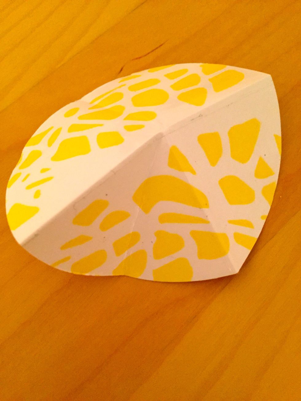 Fold in the centers of the circles to make triangles.