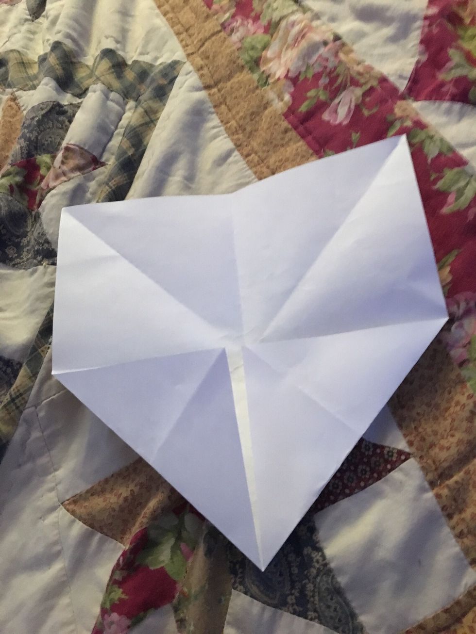 Fold in the corners and it should make another square