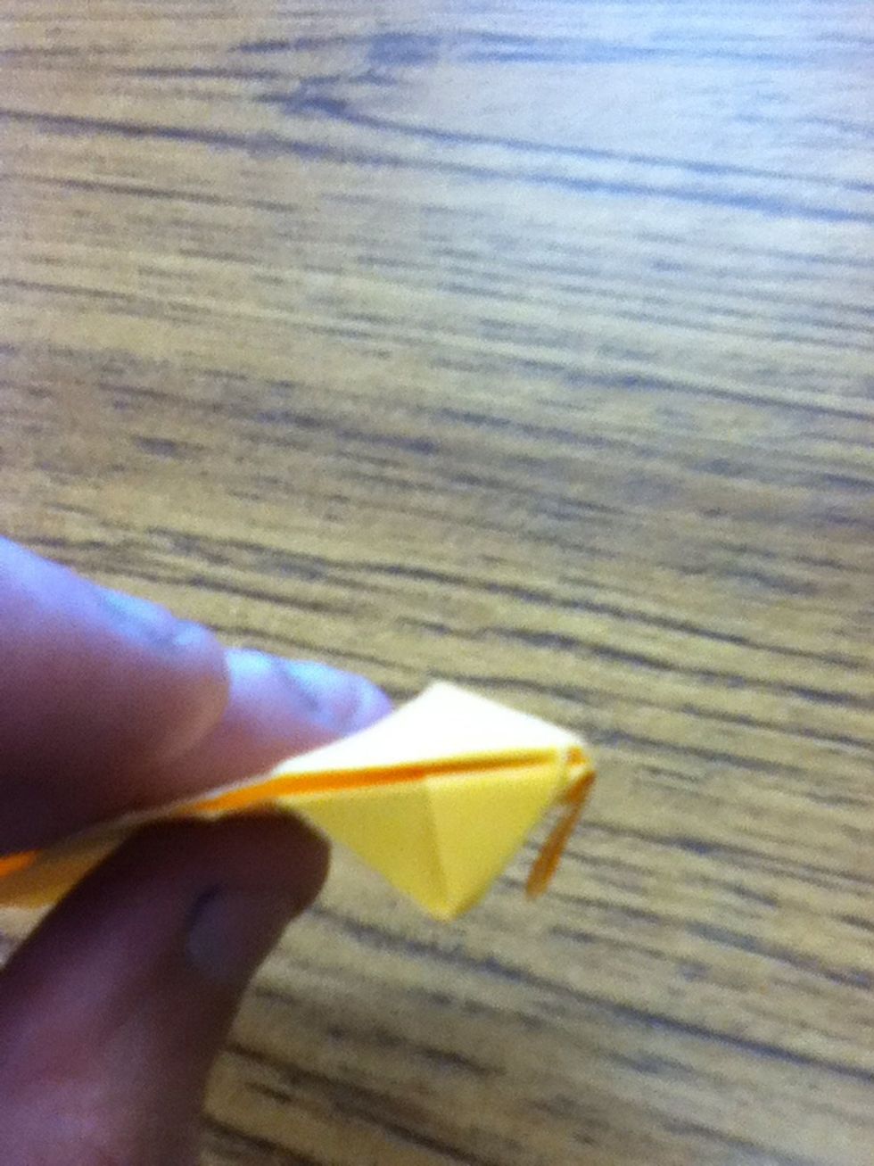 Fold in the corners on the other side
