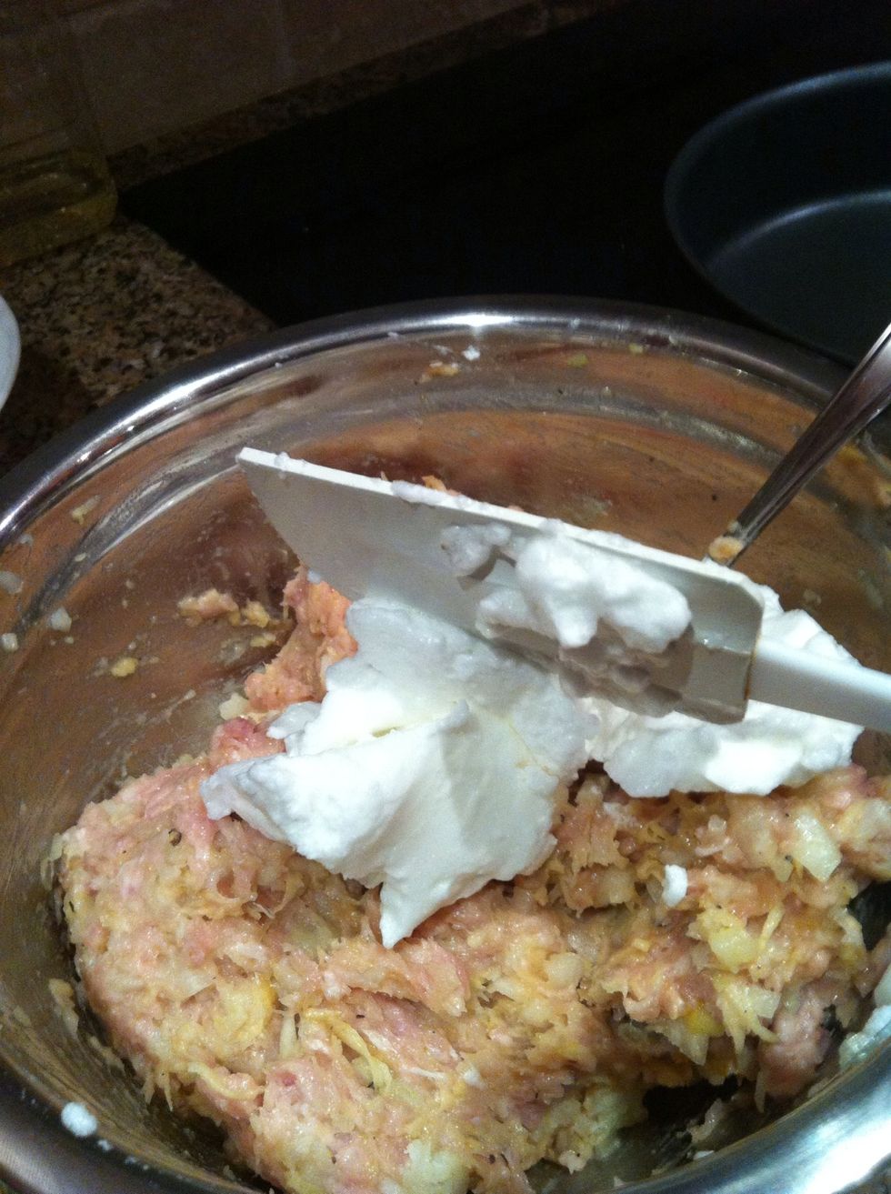 Fold in the egg white.  Just like you would when adding whipped egg whites to a cake.
