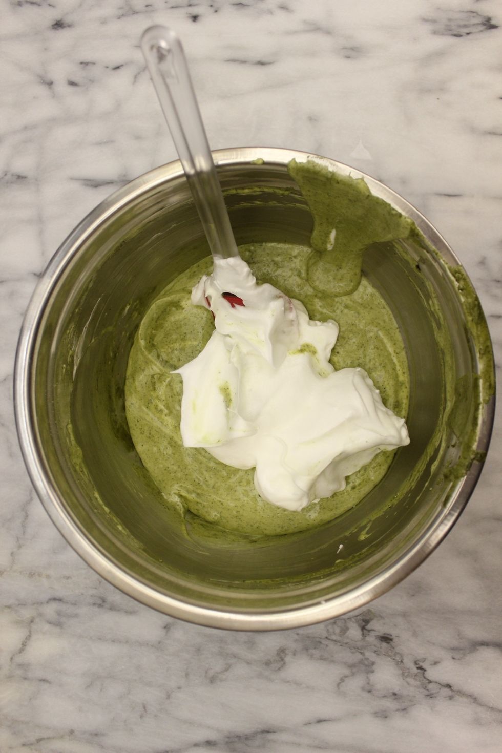 Fold in the next 1/3 of meringue.