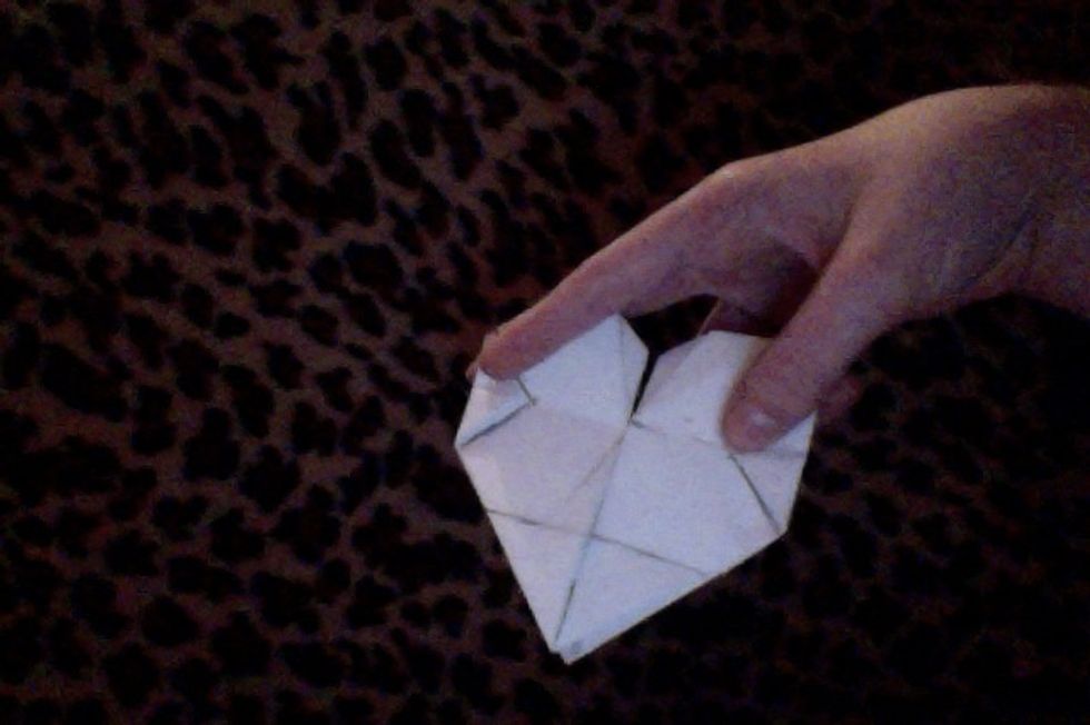 Fold in the side corners, then flip over.