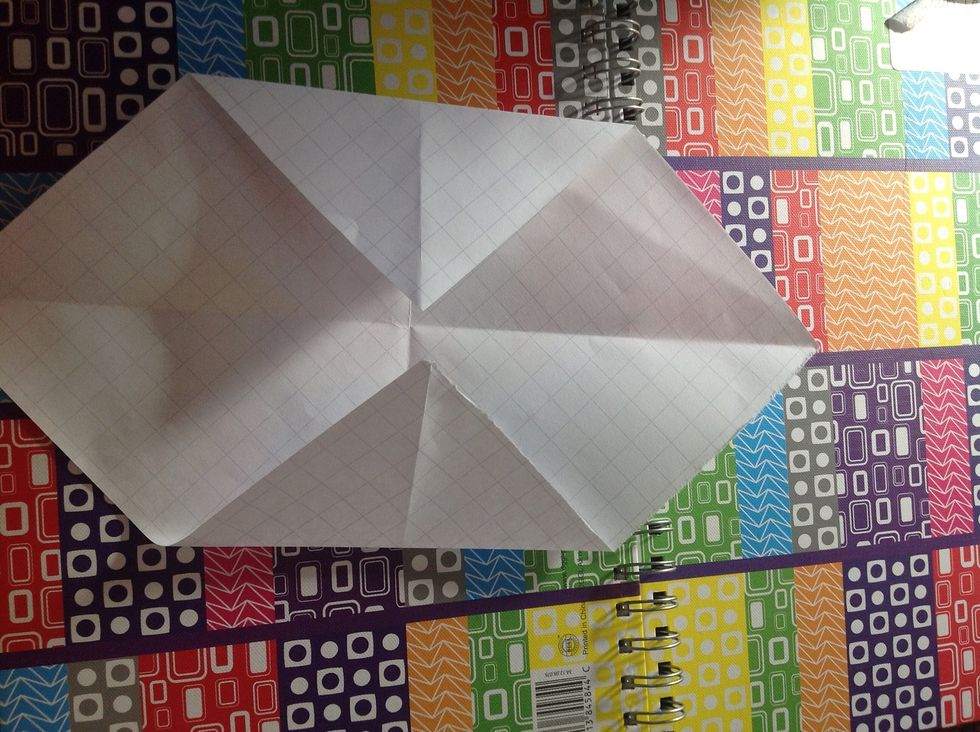 Fold in the top and bottom corners to the middle