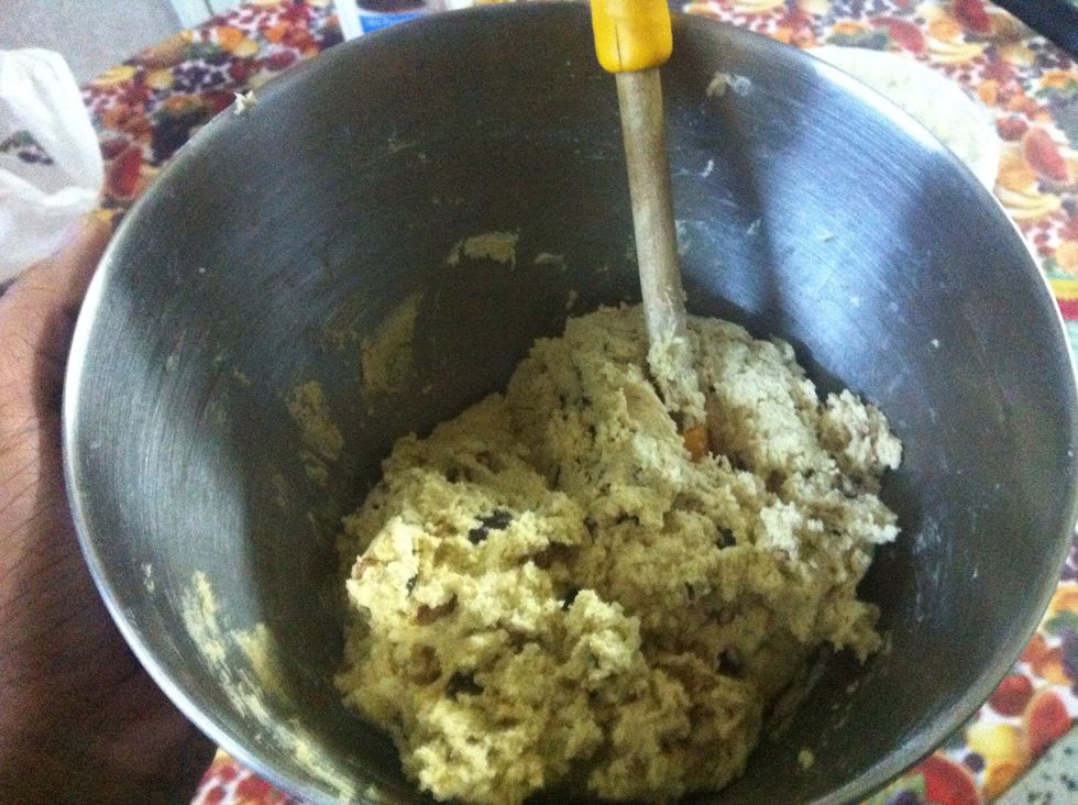 Fold in with a spatula or wooden spoon. Cover with plastic and refrigerate for 30 minutes to firm it up a bit or else the cookies will just melt into a flat disk in the oven