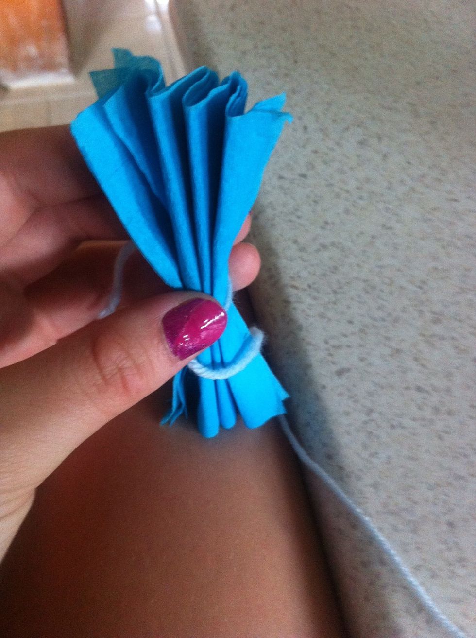 Fold into a zig zag pattern and tie string in the middle