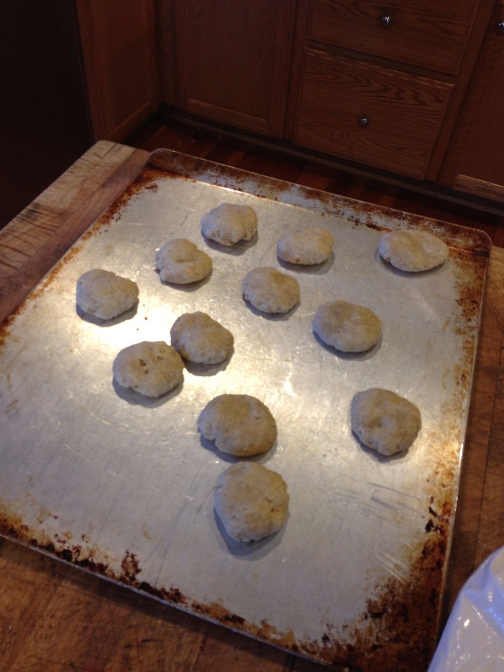 Fold into balls, press down with palm and bake at 350 for 12 min or until bottoms are golden