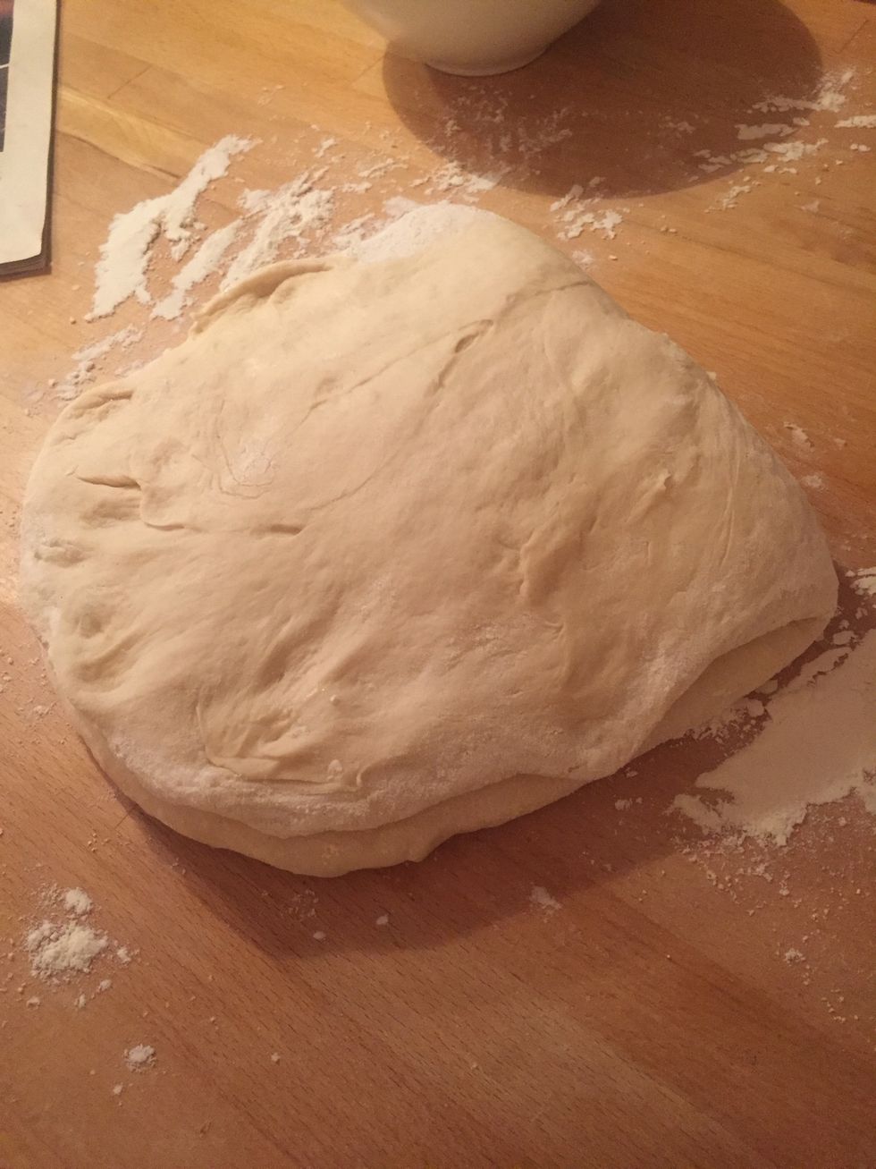 Fold into two layers over the centreline to embed the butter.