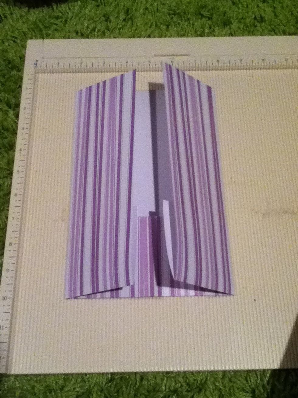 Fold inward using the scored lines you just made.