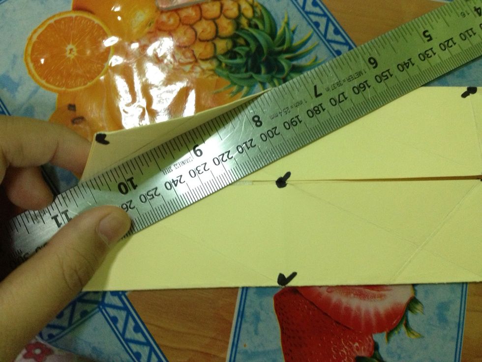 Fold it again diagonally. Tap the photo to see the whole picture.