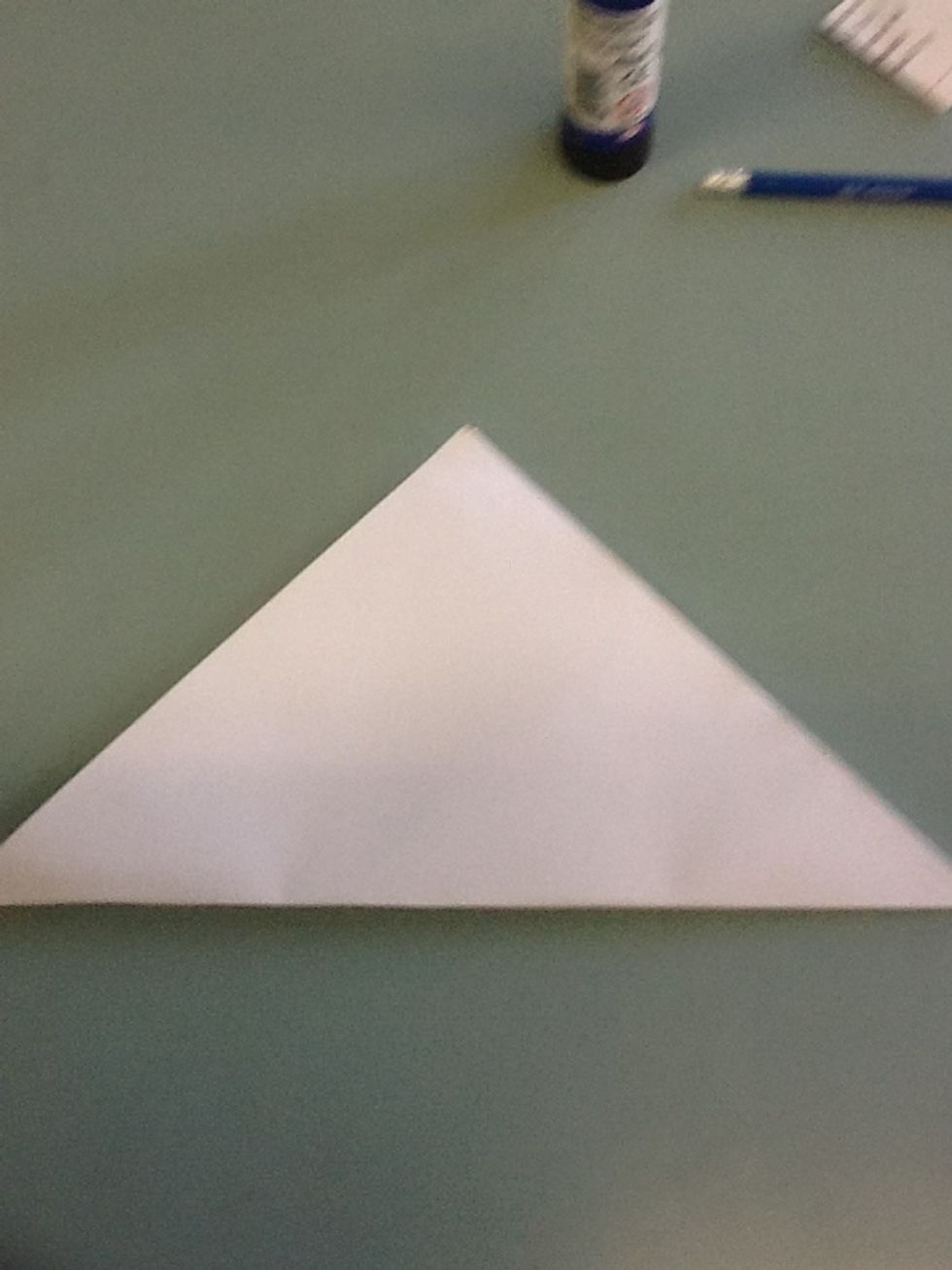 Fold it from corner to corner so it makes a triangle