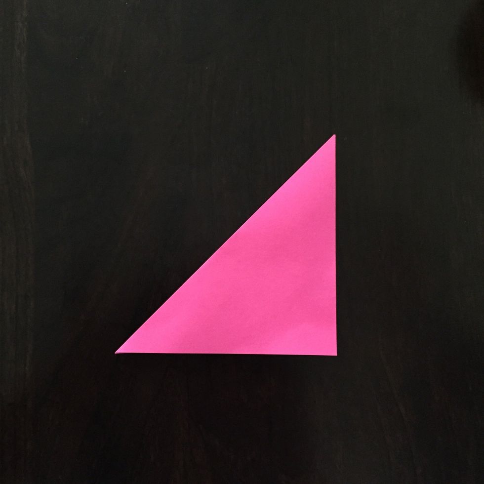 Fold it in half diagonally.