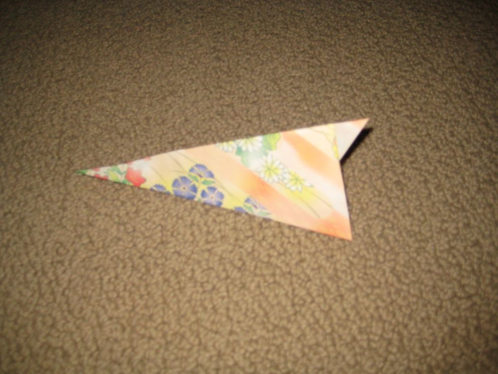 Fold it in half. It can now stand up.