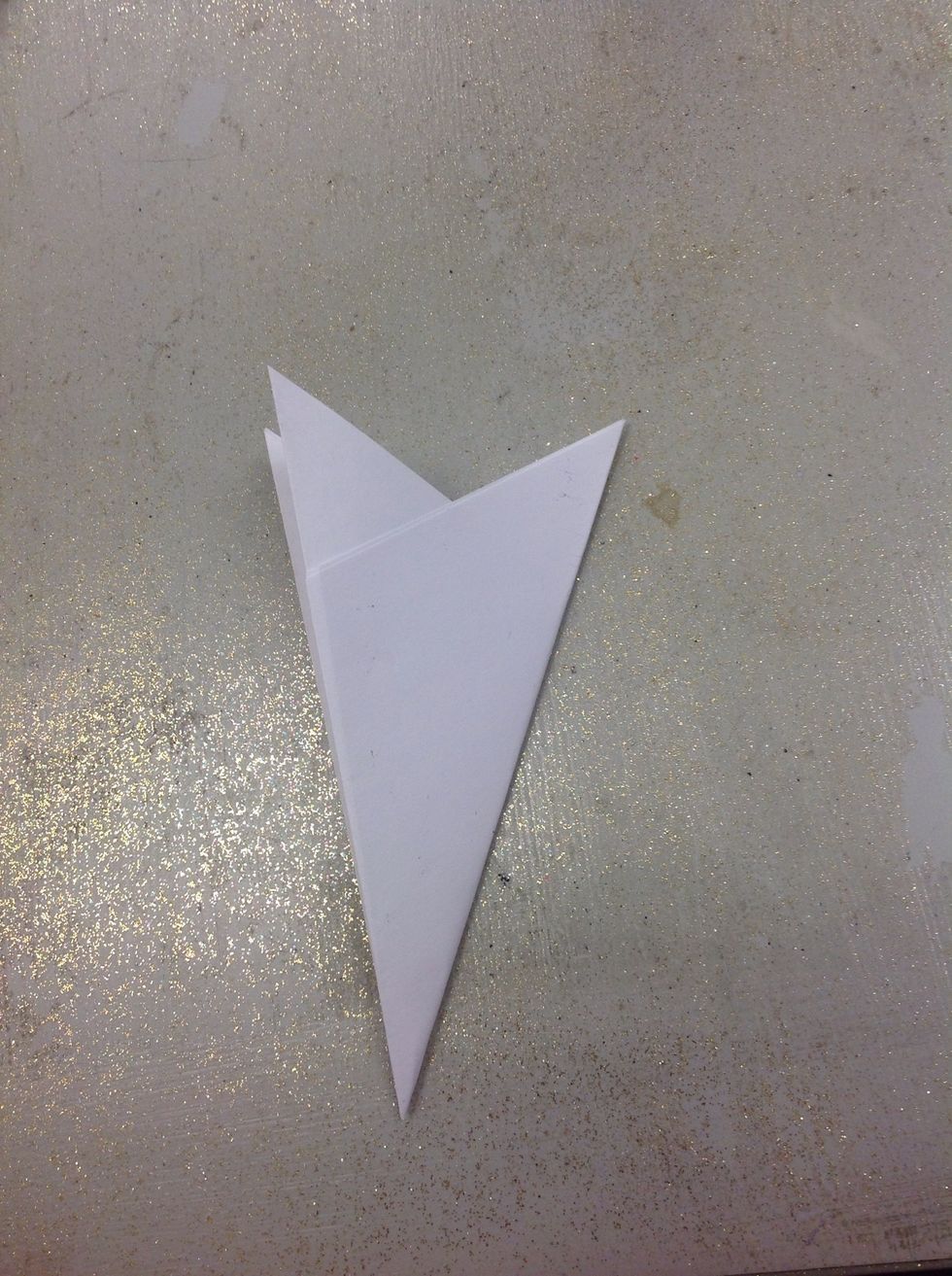 Fold it in half! Press the folds down as much as you can.