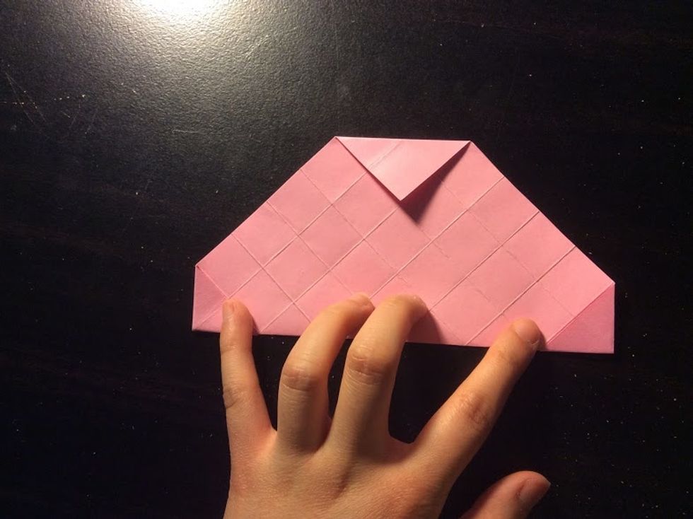 Fold it in half, then unfold it. Rotate it 90\u00b0, then repeat.