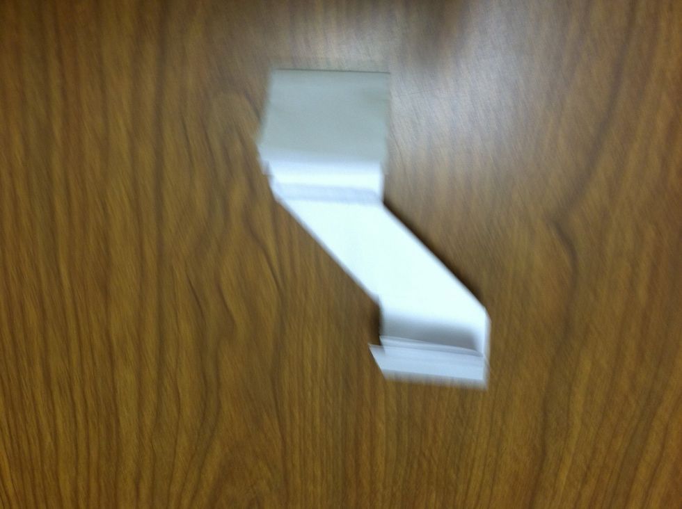 Fold it in half until it meets the ridge.