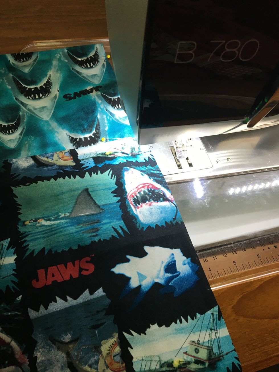 Fold it in half WRONG sides together... (remember, you are going to hide the raw edges... stick with me here) Sew one down one side and across the bottom, 1/4 inch seam.