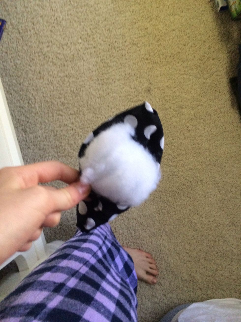 Fold it inside out and stuff it with the stuffing or fake snow.