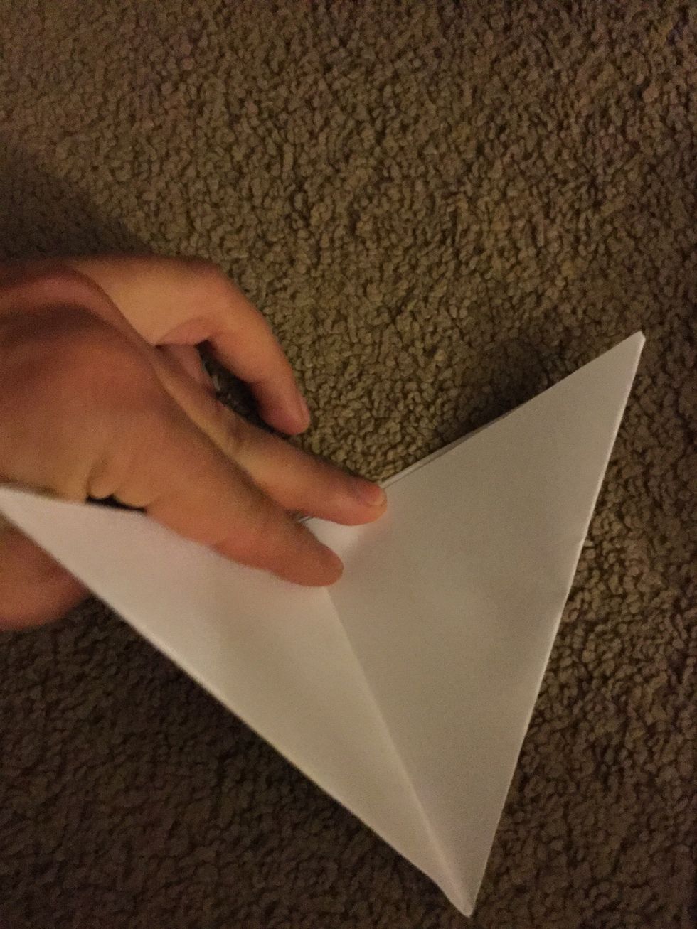 Fold it into an even smaller triangle, but then open it up again.