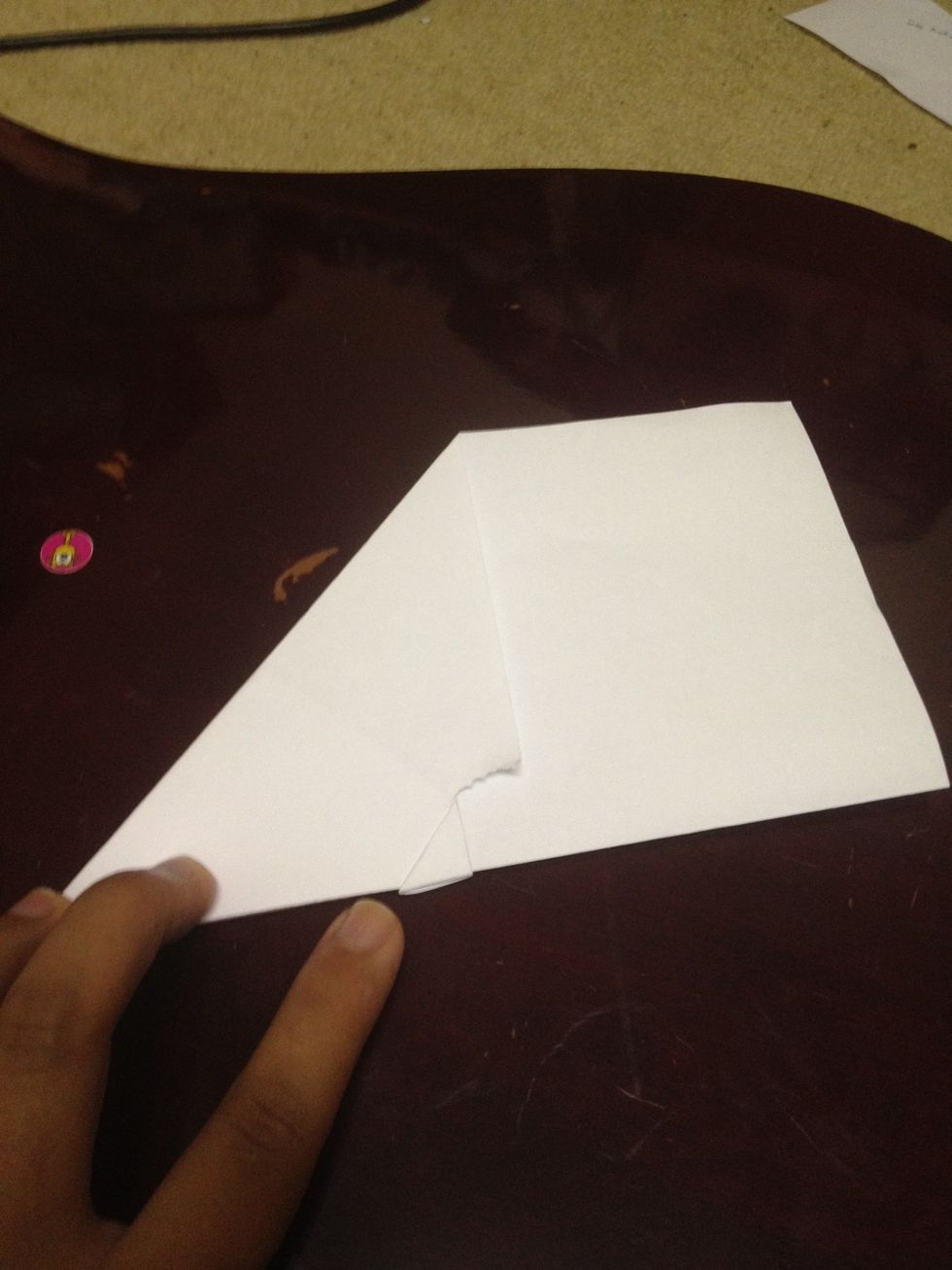 Fold it like so. if you could see the tiny triangle from the previous step, it should be on the outer part.