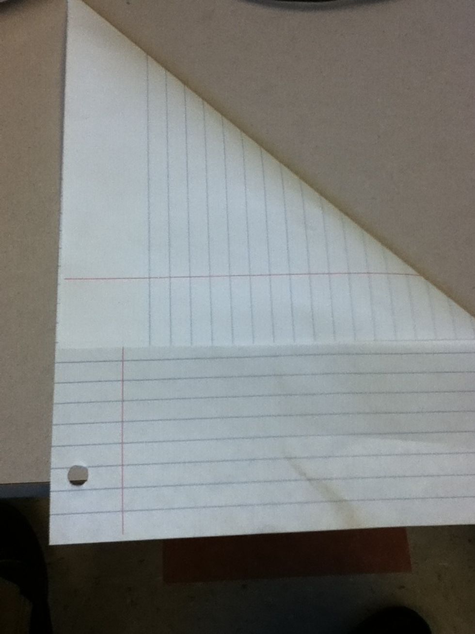 Fold it over in a triangular shape to one side