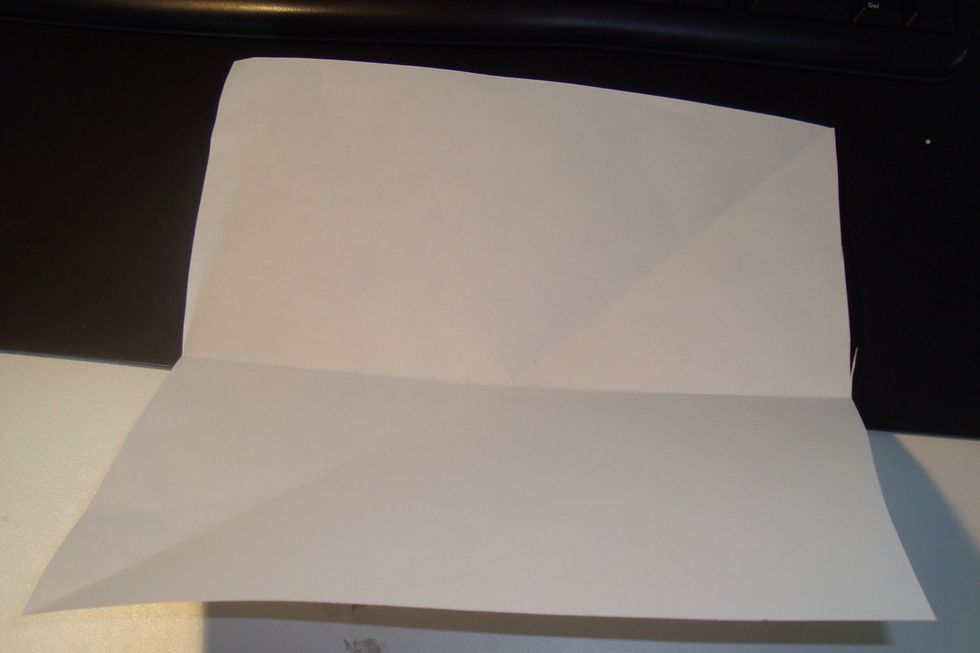 Fold it over one way like a sandwich to create a crease.