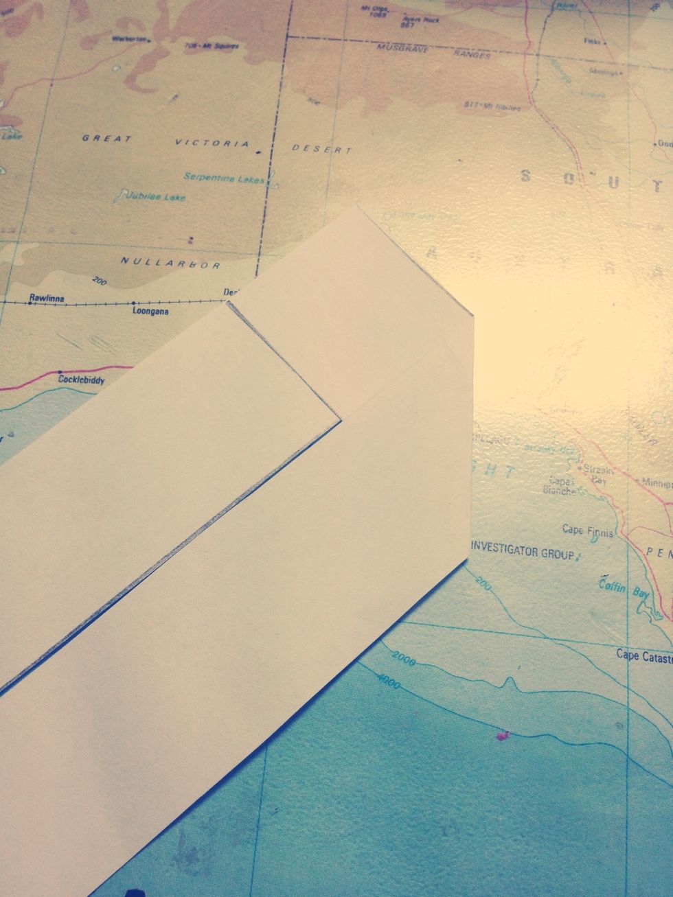 Fold it over to be parallel with the other strip.