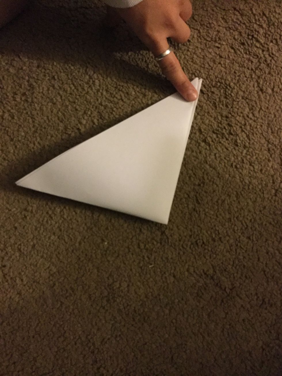 Fold it over to make a smaller triangle.