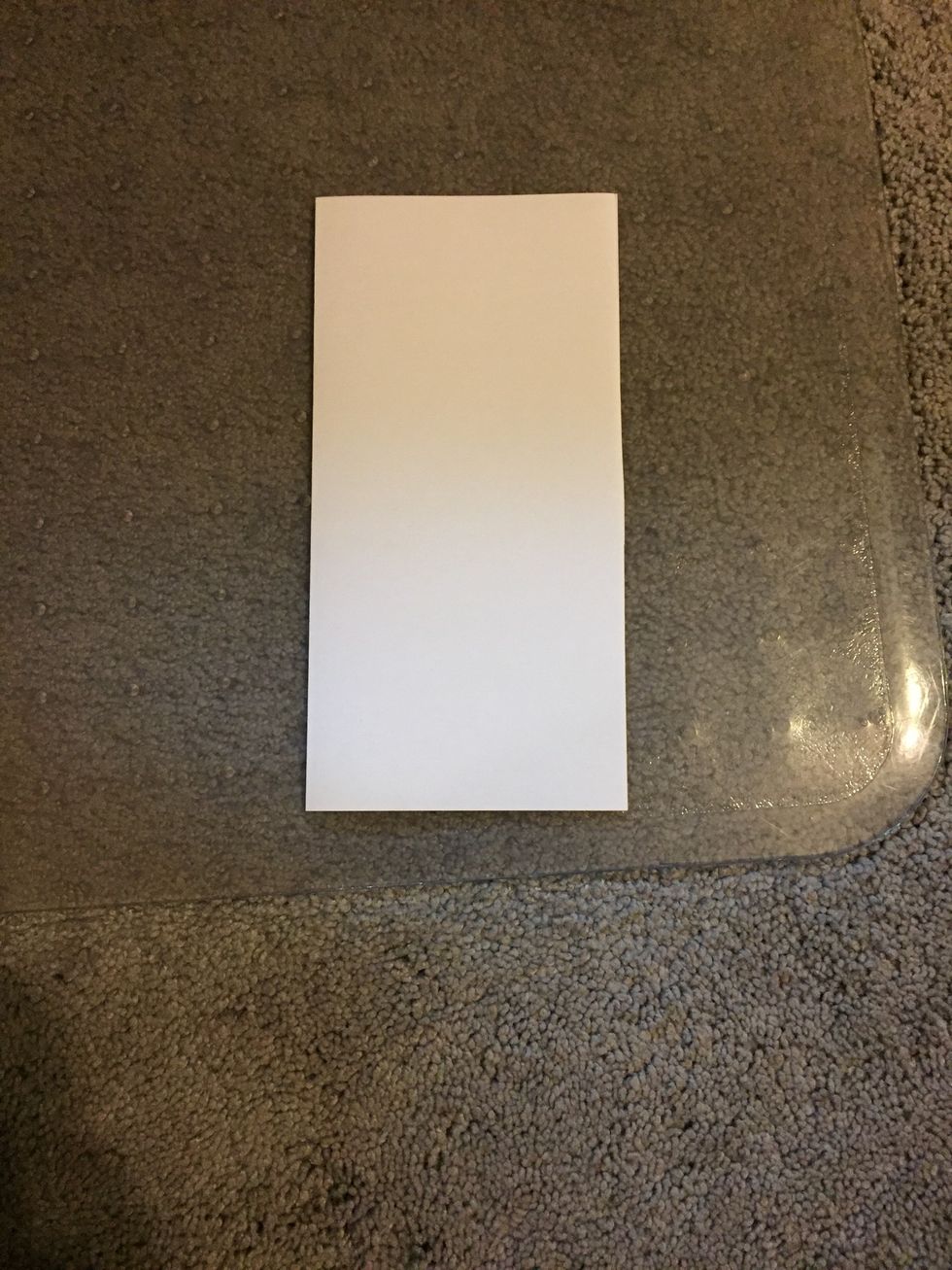 Fold it vertically across the middle