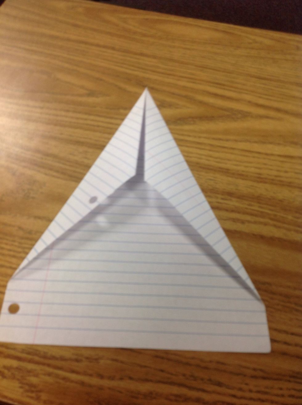 Fold left corner again to the center