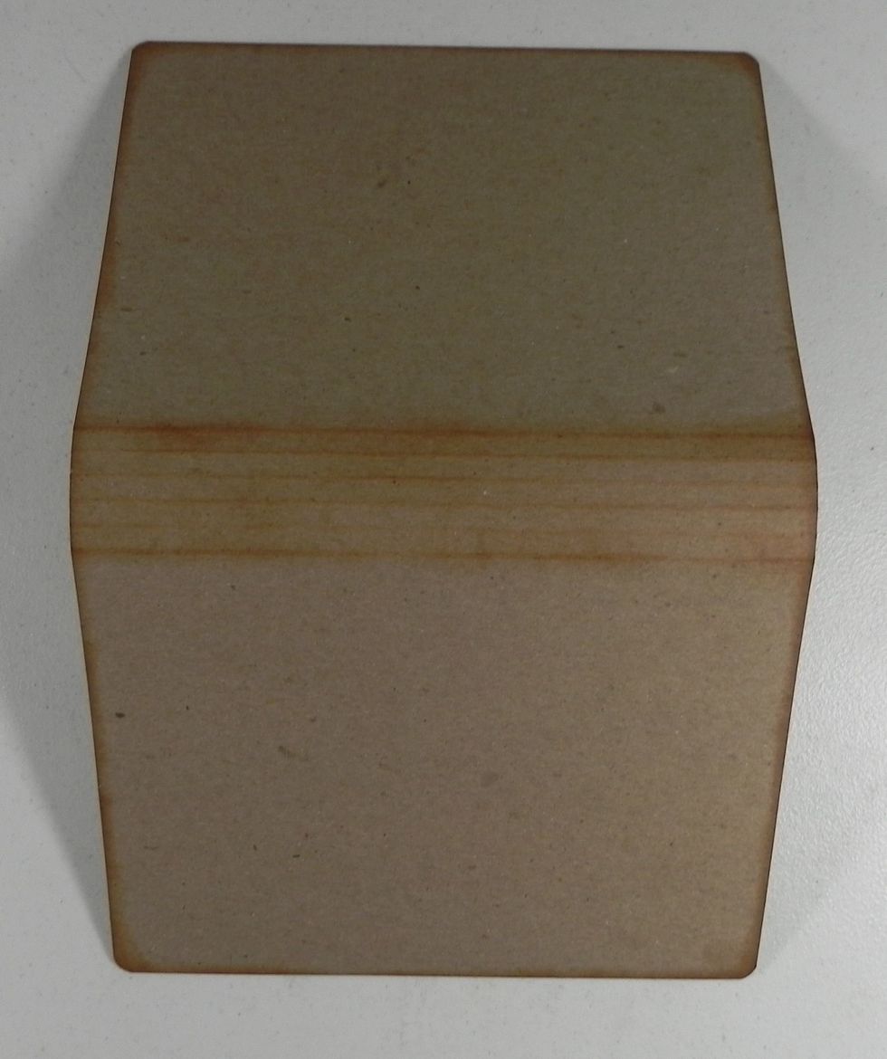 Fold lightly on the score lines. Punch the corners with 1/4" corner rounder. Ink edges.