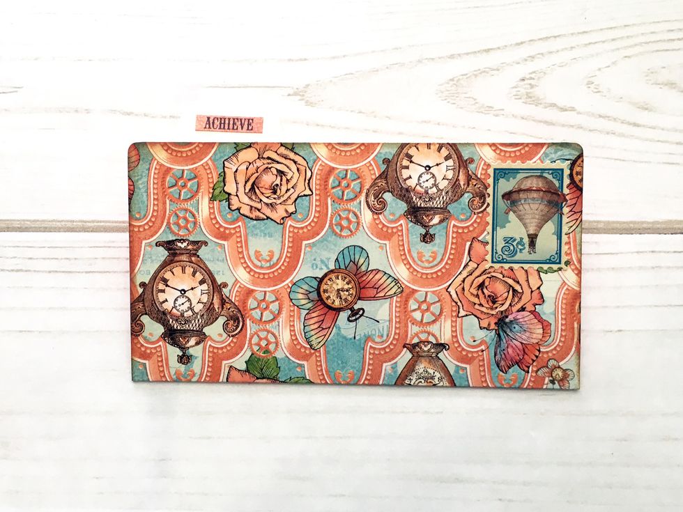 Fold like a file folder & cut a tab to glue at the top of the folder. Add a word from the sticker sheet. Round the corners as desired.  Then tuck into the pocket created in step 32.