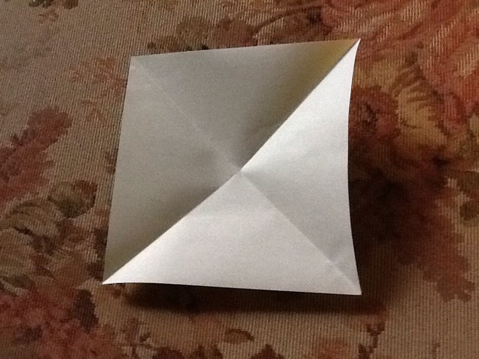 Fold like so. Diagonally. Remember to fold it the way like in the picture.
