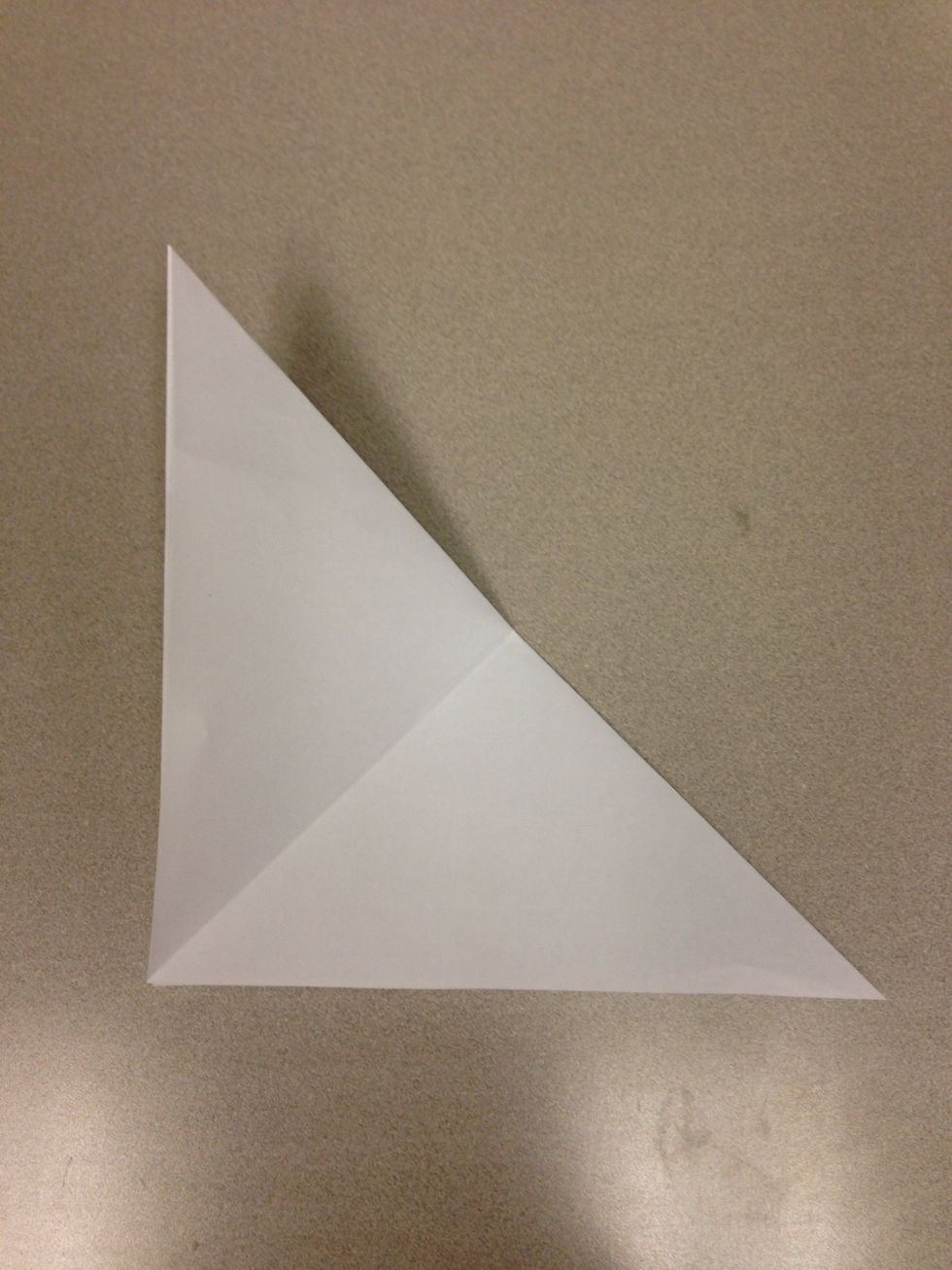 Fold little corners to each other to make smaller triangle