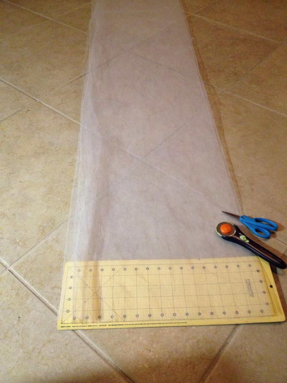 Fold material to cut. For a princess like tutu, use longer pieces, for shorter tutu, use smaller pieces. Mine is cut into 5" wide and about 12" long for a tiny tutu that sticks straight out.